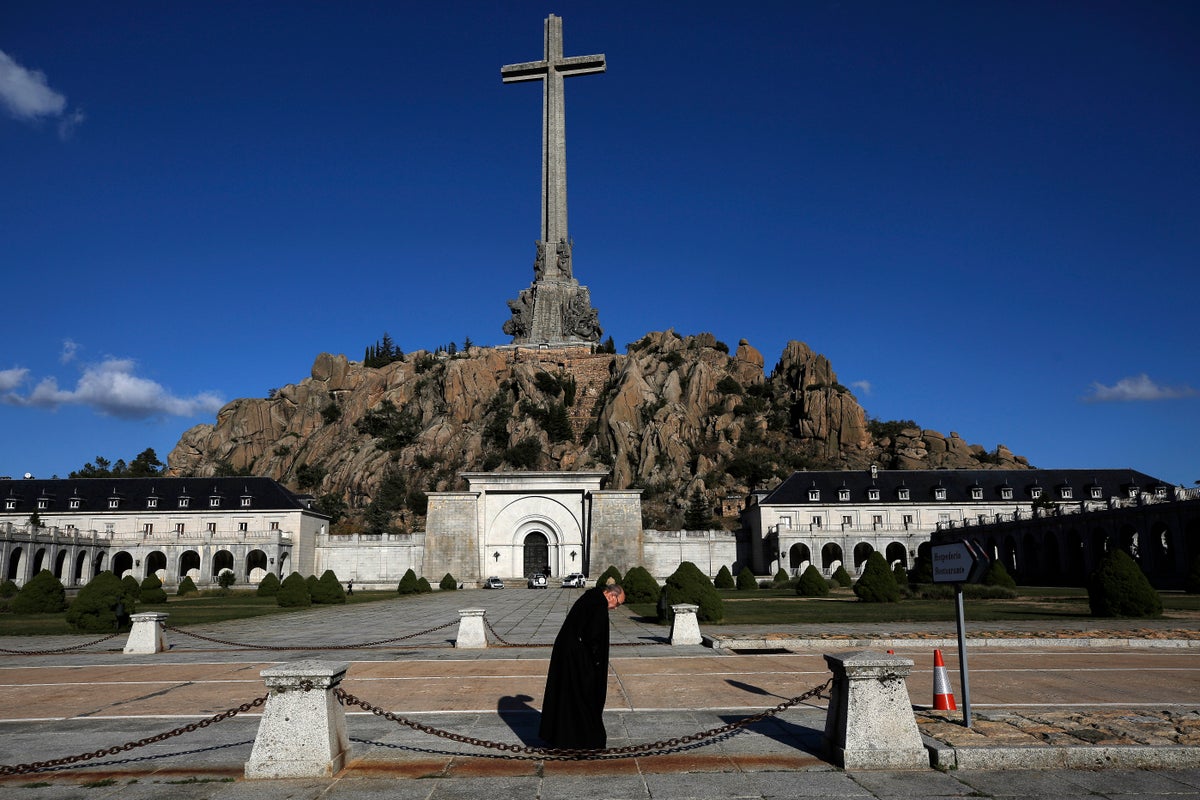 Spain exhumes fascist party founder from mausoleum