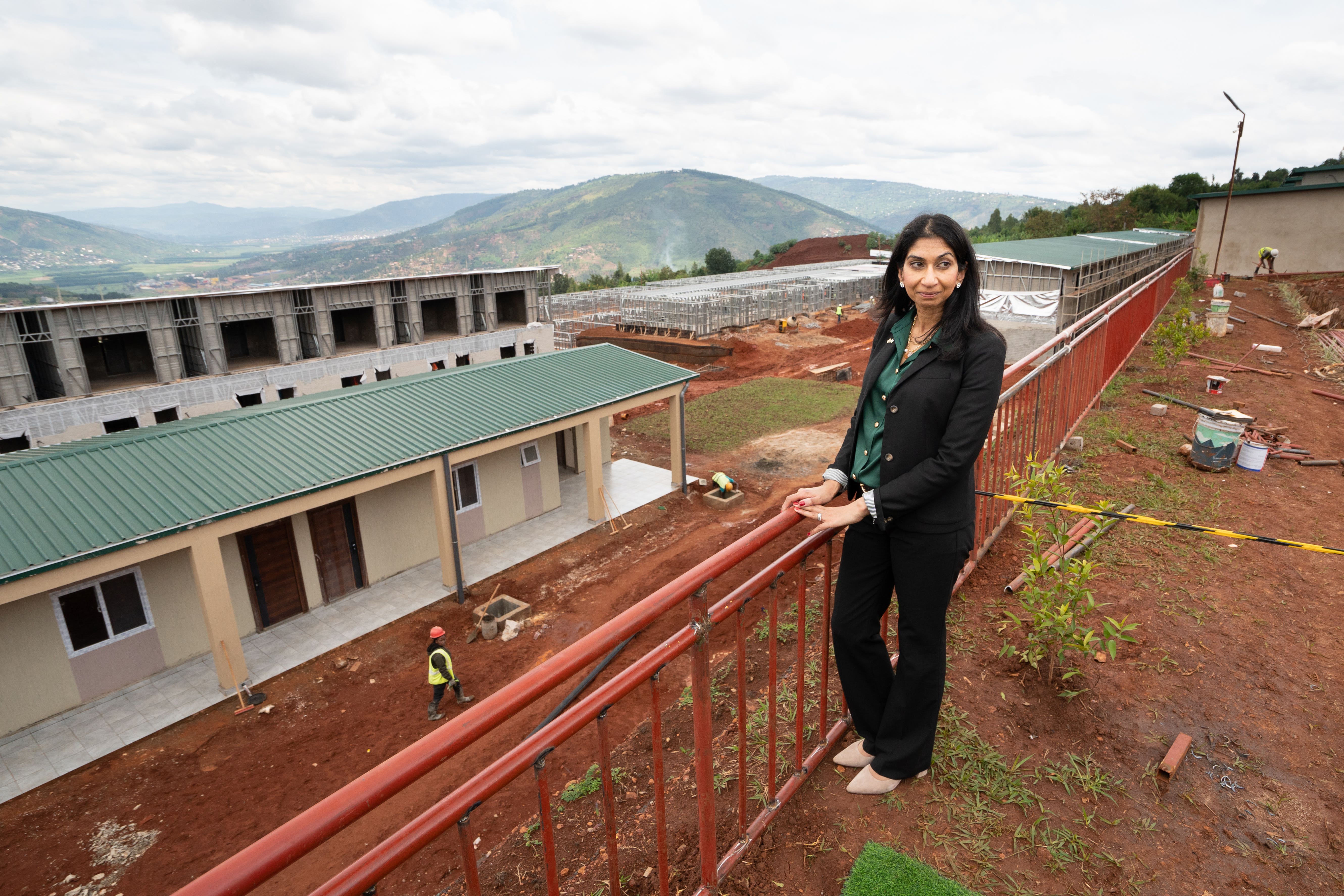 Suella Braverman tours a building site for migrant accommodation on the outskirts of Kigali in April
