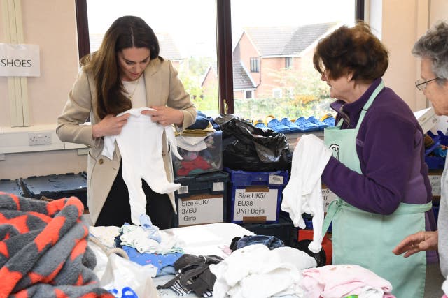 The Princess of Wales (left) sorts donations during a visit to The Baby Bank in Windsor (Jeremy Selwyn/Evening Standard/PA)