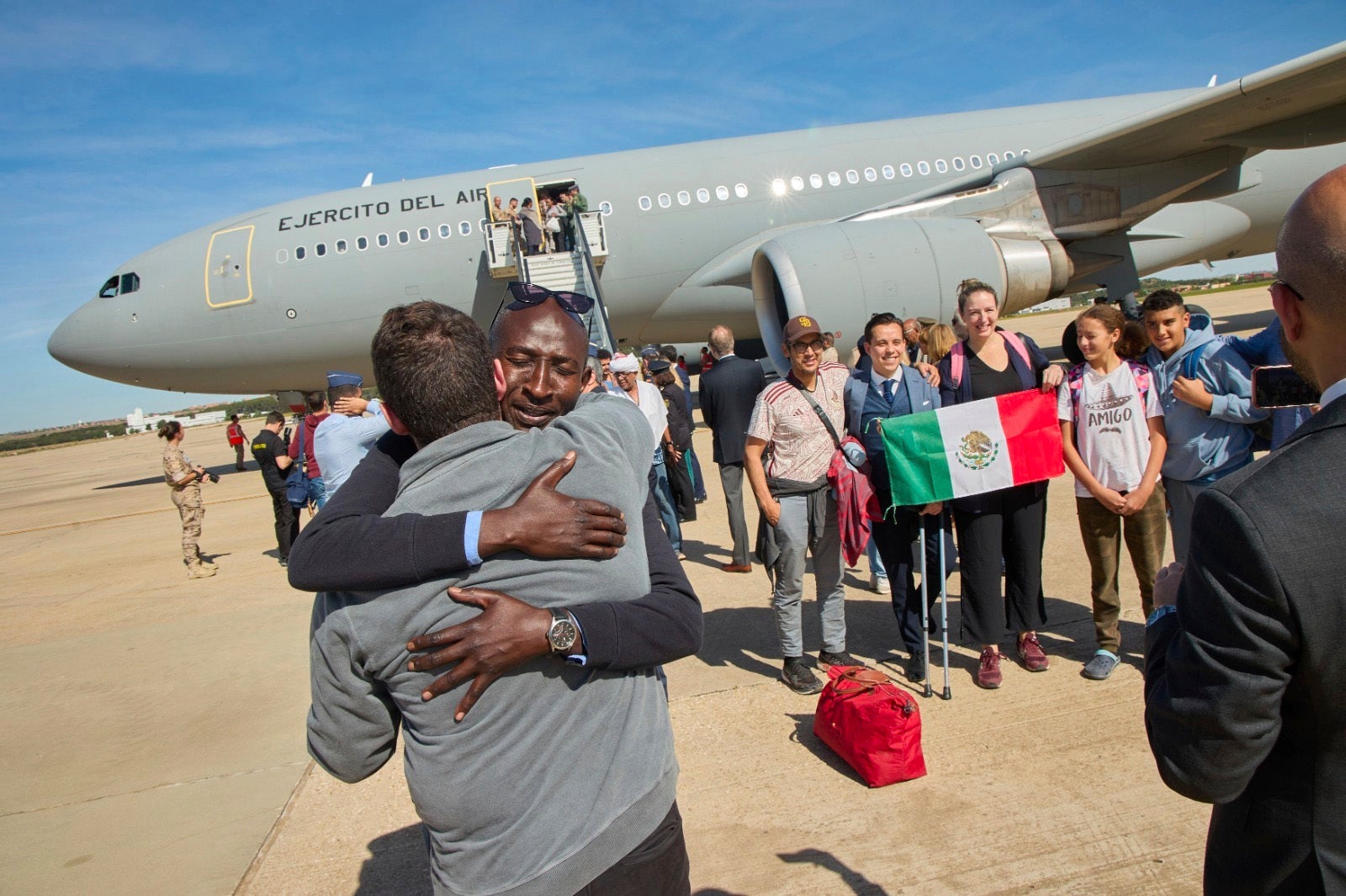 Passengers disembark in Madrid after fleeing Sudan on a Spanish Air Force aircraft