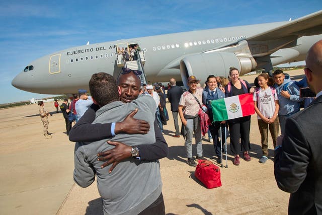 <p>Passengers from Sudan disembark from a Spanish Air Force aircraft at Torrejon Air Base in Madrid</p>