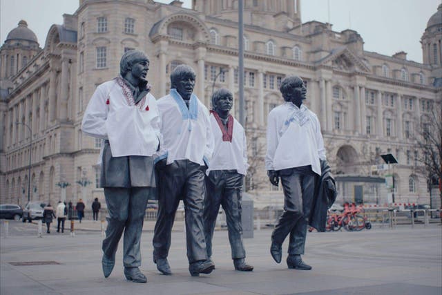 For use in UK, Ireland or Benelux countries only Undated BBC handout photo of the Beatles statue at Pier Head in Liverpool, which has been dressed in traditional Ukrainian clothing ahead of Eurovision (BBC Studios/PA)