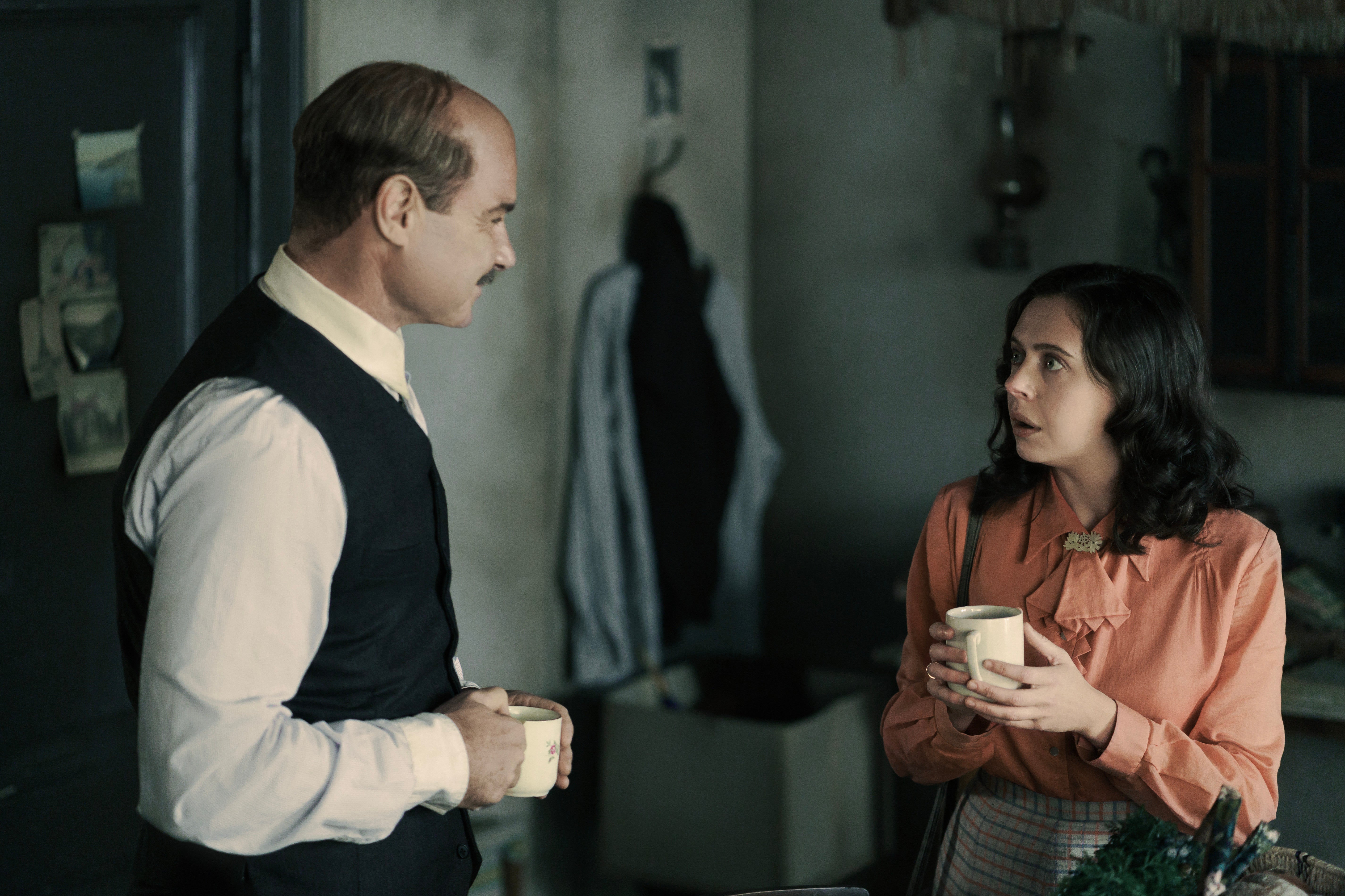 Liev Shreiber, left, plays Otto Frank, while Bel Powley, right, plays Miep Gies, who was an employee and friend of the Franks before the war