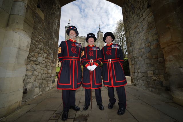 <p>Yeoman Warders, also known as Beefeaters, in their new uniform ahead of King Charles III’s coronation, at the Tower of London (Yui Mok/PA)</p>