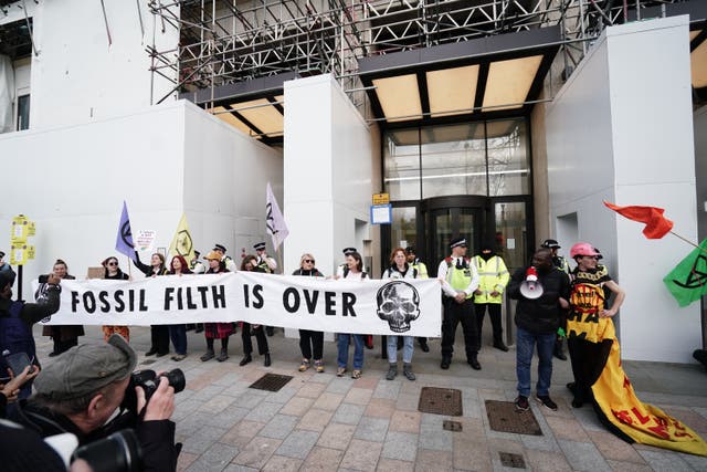 Extinction Rebellion demonstrators outside the Shell Building in London (Jordan Pettitt/PA)