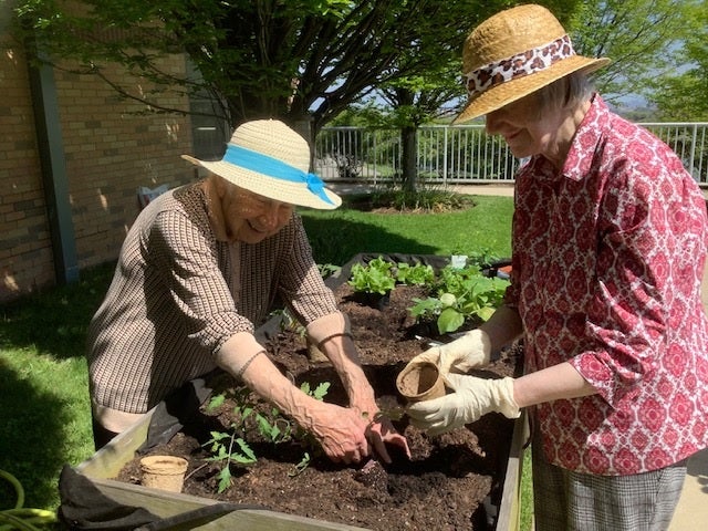 Sisters Eleanor Maragliano and Anne Collins, members of Sisters of St Joseph of Peace, working in their garden. The median age of the Sisters is 83 and their investment portfolio helps take care of their elderly members and fund missionary work