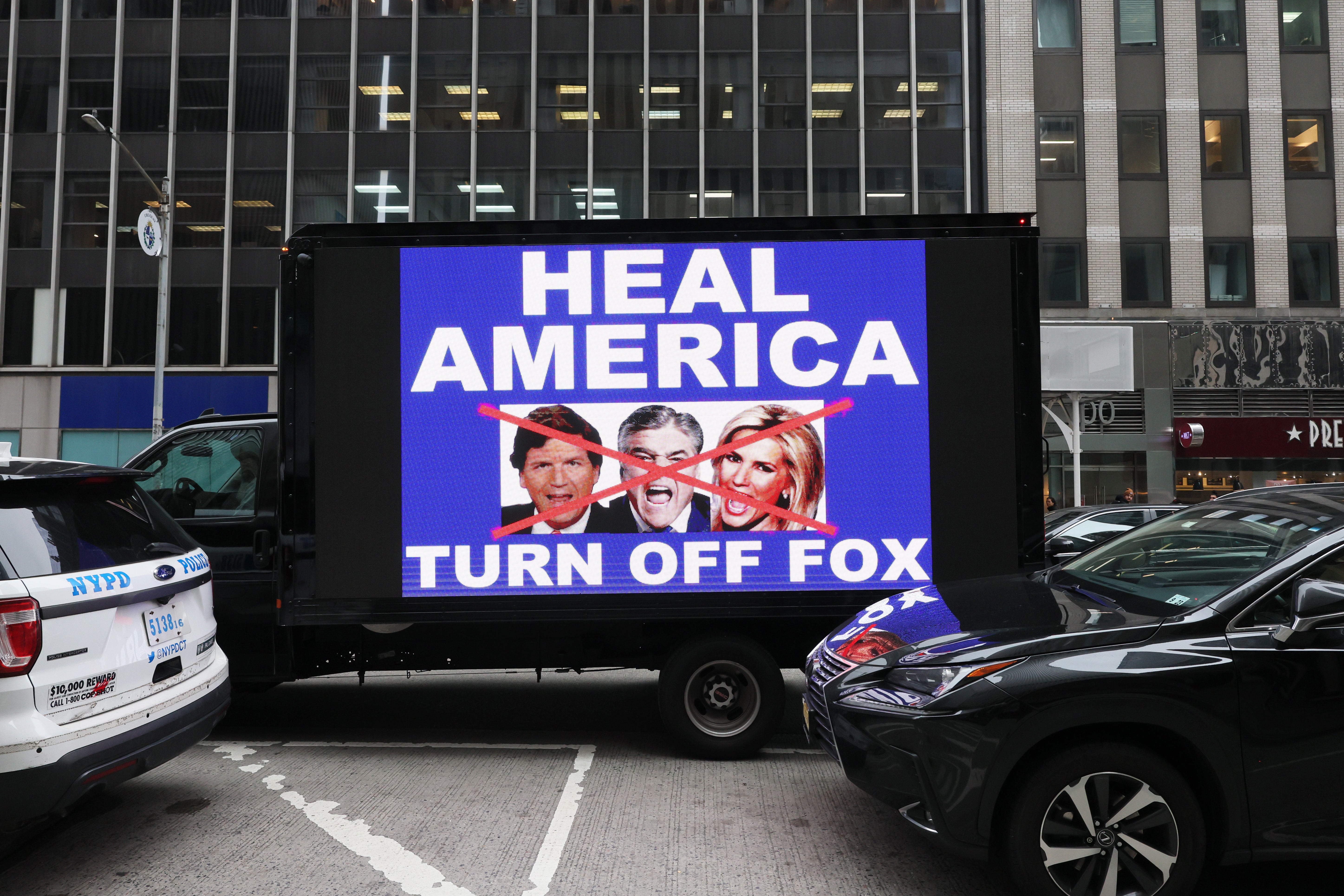 A video truck displays a message as members of the Rise and Resist protest group take part in their weekly ‘Truth Tuesday’ protest at News Corp headquarters on February 21, 2023 in New York City