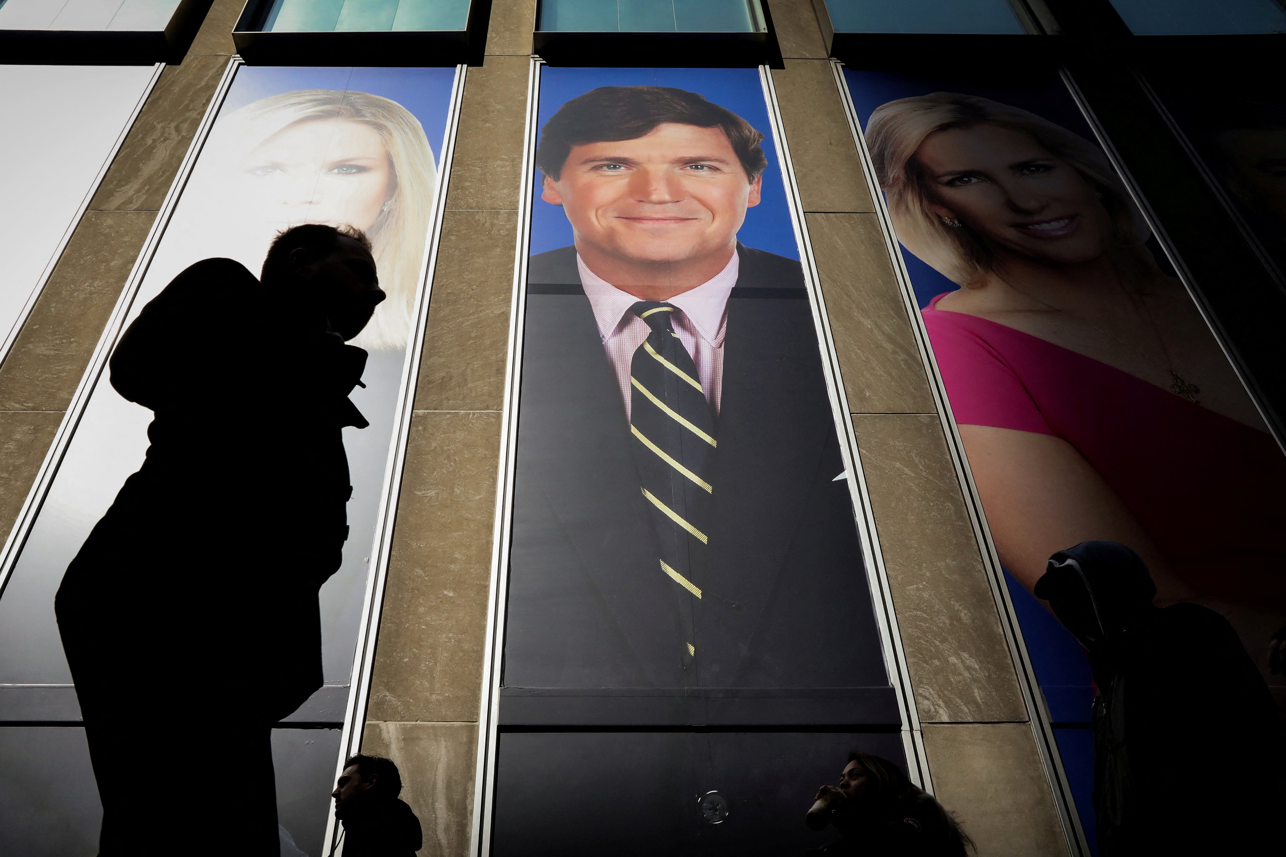A promo photo of Fox News host Tucker Carlson on the News Corp building in New York. The primetime anchor ‘parted’ with the network on Monday
