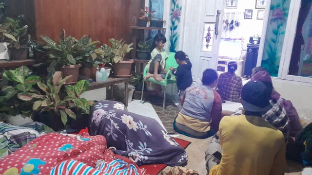 <p>People stay outside of their house and hospital after a magnitude 7.3 earthquake occurred in their area in Muara Sikabaluan village, on Siberut Island </p>