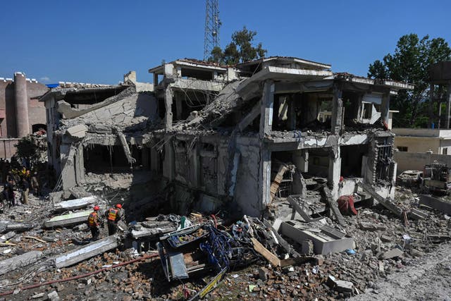 <p>Rescue teams search for victims in the rubble of a badly damaged building a day after multiple explosions caused by fire in a munitions cache levelled a specialist counter-terrorism police station in Kabal </p>
