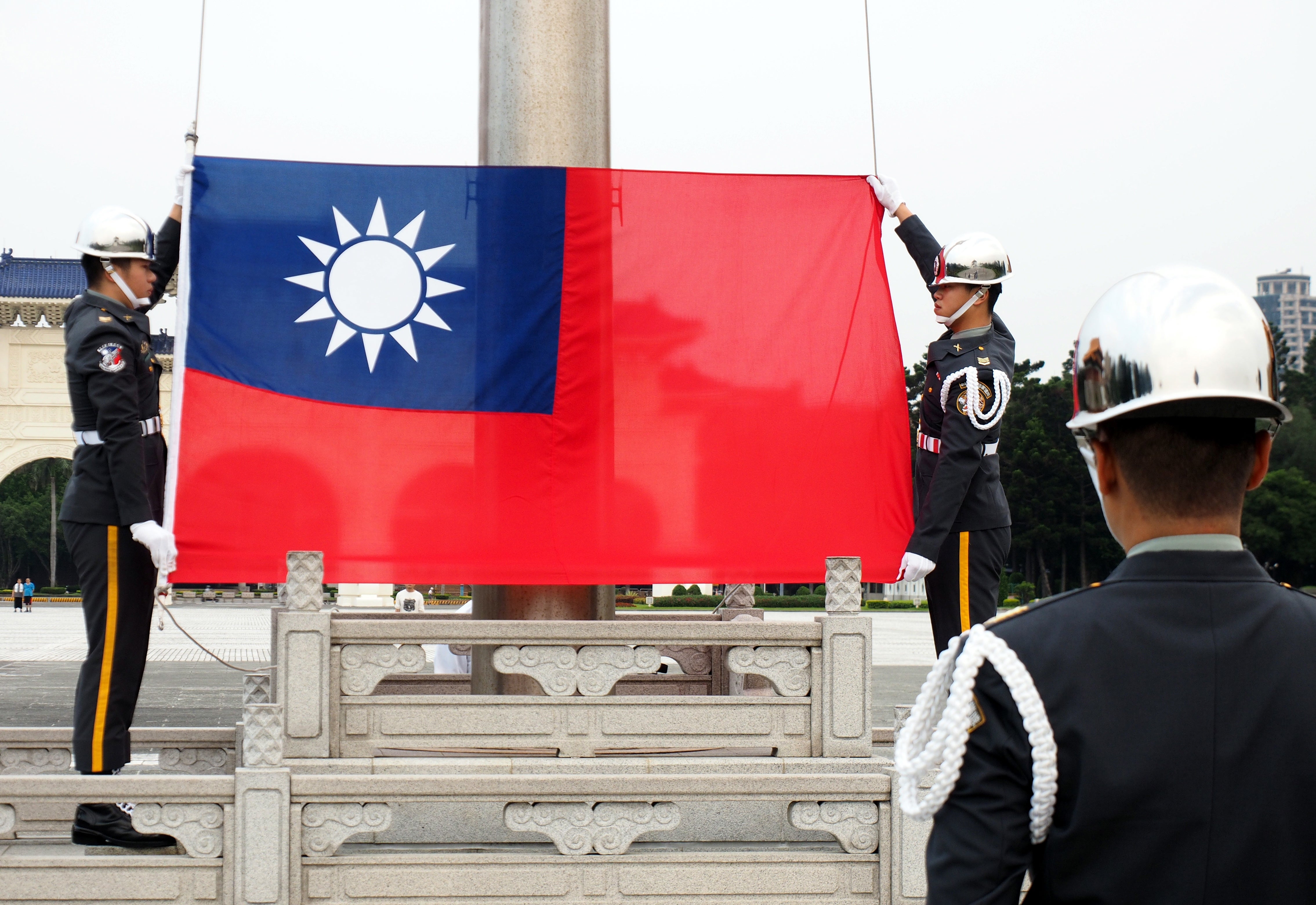 Soldiers hoist the flag of Taiwan in Taipei