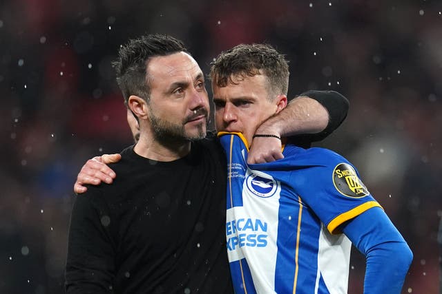 Brighton and Hove Albion manager Roberto De Zerbi comforts Solly March after missing a penalty in the shootout following the Emirates FA Cup semi-final match at Wembley Stadium, London. Picture date: Sunday April 23, 2023.