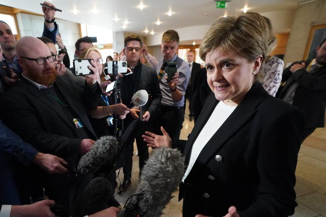 Former Scottish first minister Nicola Sturgeon talking to media as she returns to the Scottish Parliament (Andrew Milligan/PA)