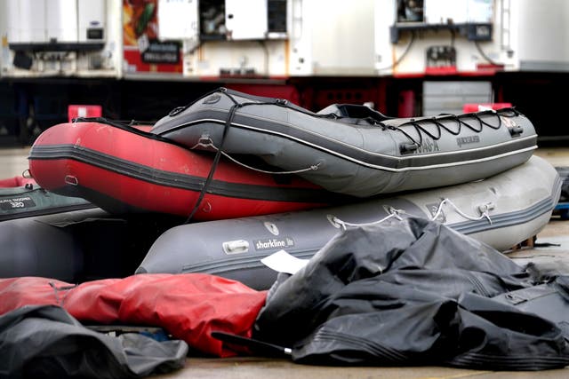 Small boats and outboard motors thought to be used by migrants crossing the Channel (Gareth Fuller/PA)