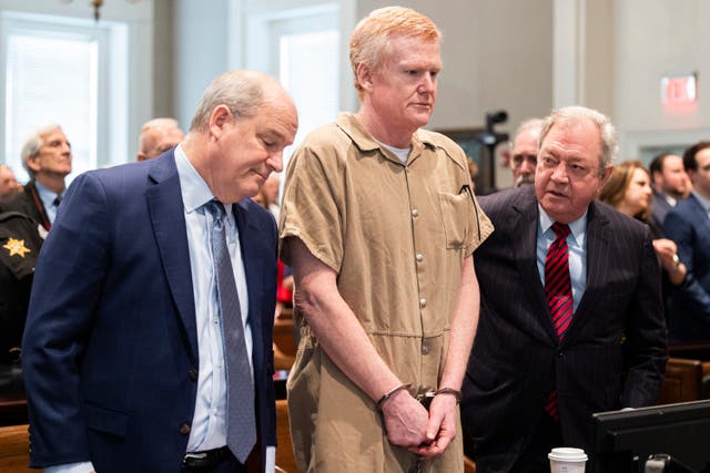 <p>Alex Murdaugh speaks with his legal team before he is sentenced to two consecutive life sentences in March 2023</p>