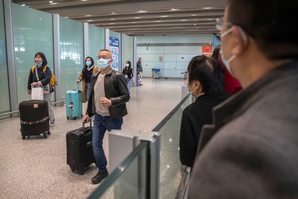 China to scrap PCR test requirement for inbound travelers | The Independent