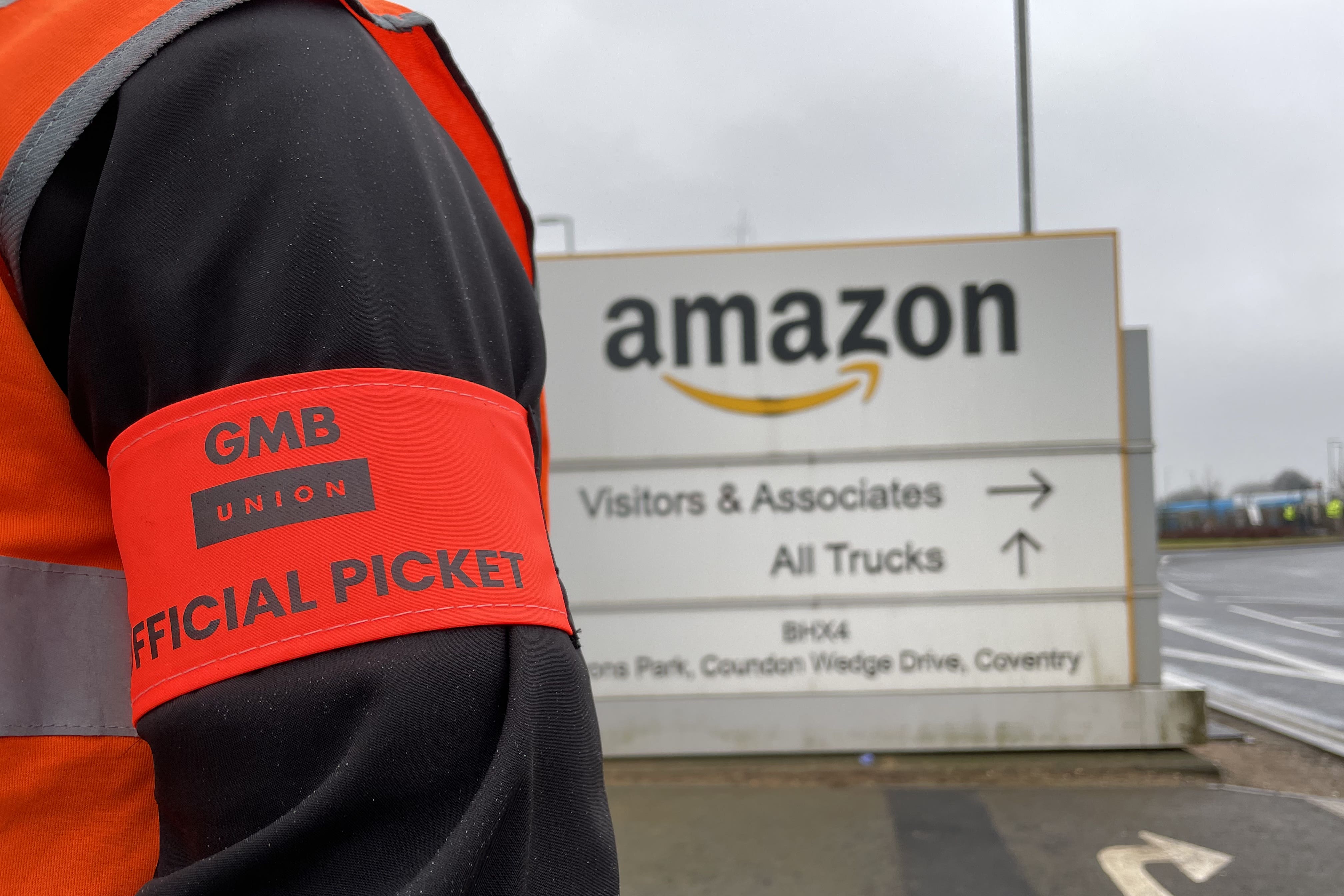 Members of the GMB union on the picket line outside the Amazon fulfilment centre in Coventry (Phil Barnett/PA)
