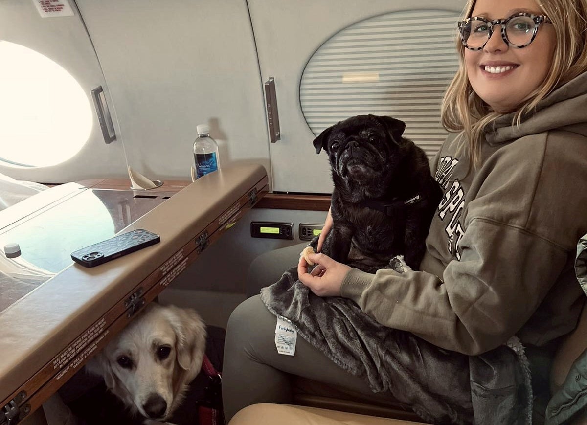 Maddie Young, 31, said it was cheaper to fly her two dogs on a private jet