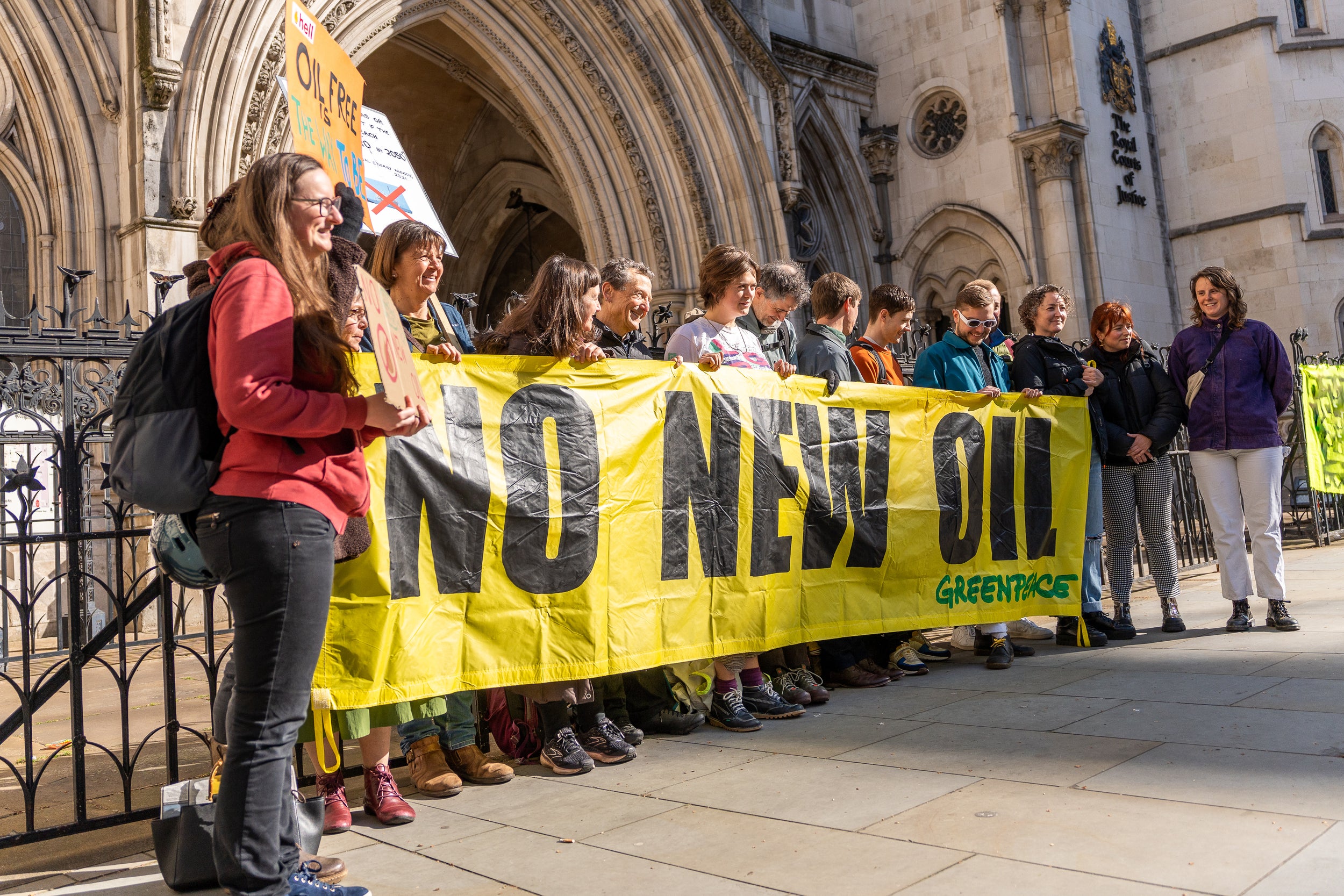 Greenpeace campaigners outside the High Court to challenge the government’s decision to announce a new round of oil and gas licensing