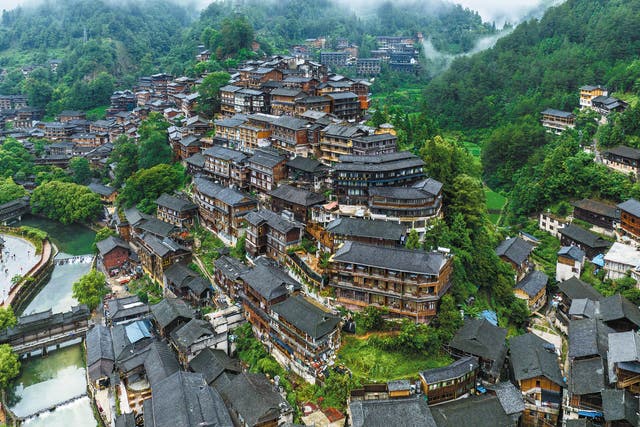 <p>Xijiang Qianhu Miao village in Guizhou province is a popular destination among visitors</p>