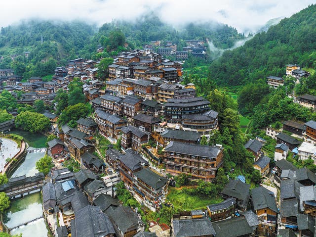 <p>Xijiang Qianhu Miao village in Guizhou province is a popular destination among visitors</p>