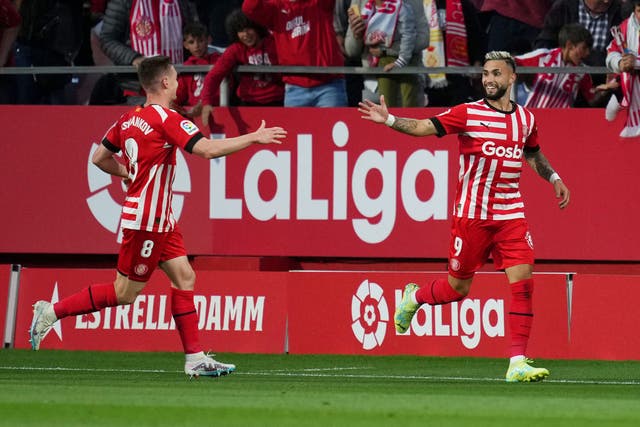 <p>Valentin Castellanos, right, celebrates his second of four goals against Real Madrid</p>