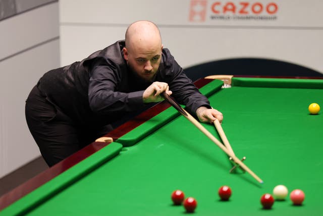 <p>Luca Brecel at the table against Ronnie O’Sullivan</p>