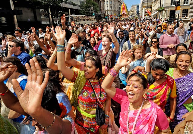 <p>Worshippers take part in the 40th Rathayatra festival in central London where three 40-foot high brightly coloured wooden chariots are pulled by hand from Hyde Park to Trafalgar Square</p>