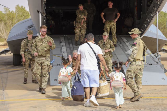 <p>British nationals being evacuated from Khartoum, Sudan by UK military personnel</p>