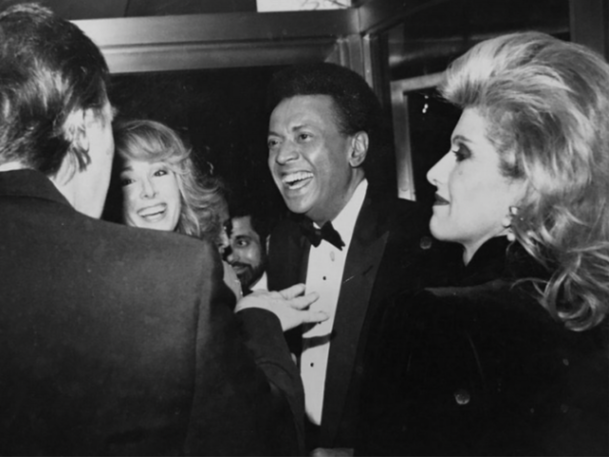 E Jean Carroll, second from left, with Donald Trump, left, her ex-husband John Johnson and Ivana Trump. Ms Carroll believes the picture was taken at an NBC party in 1987