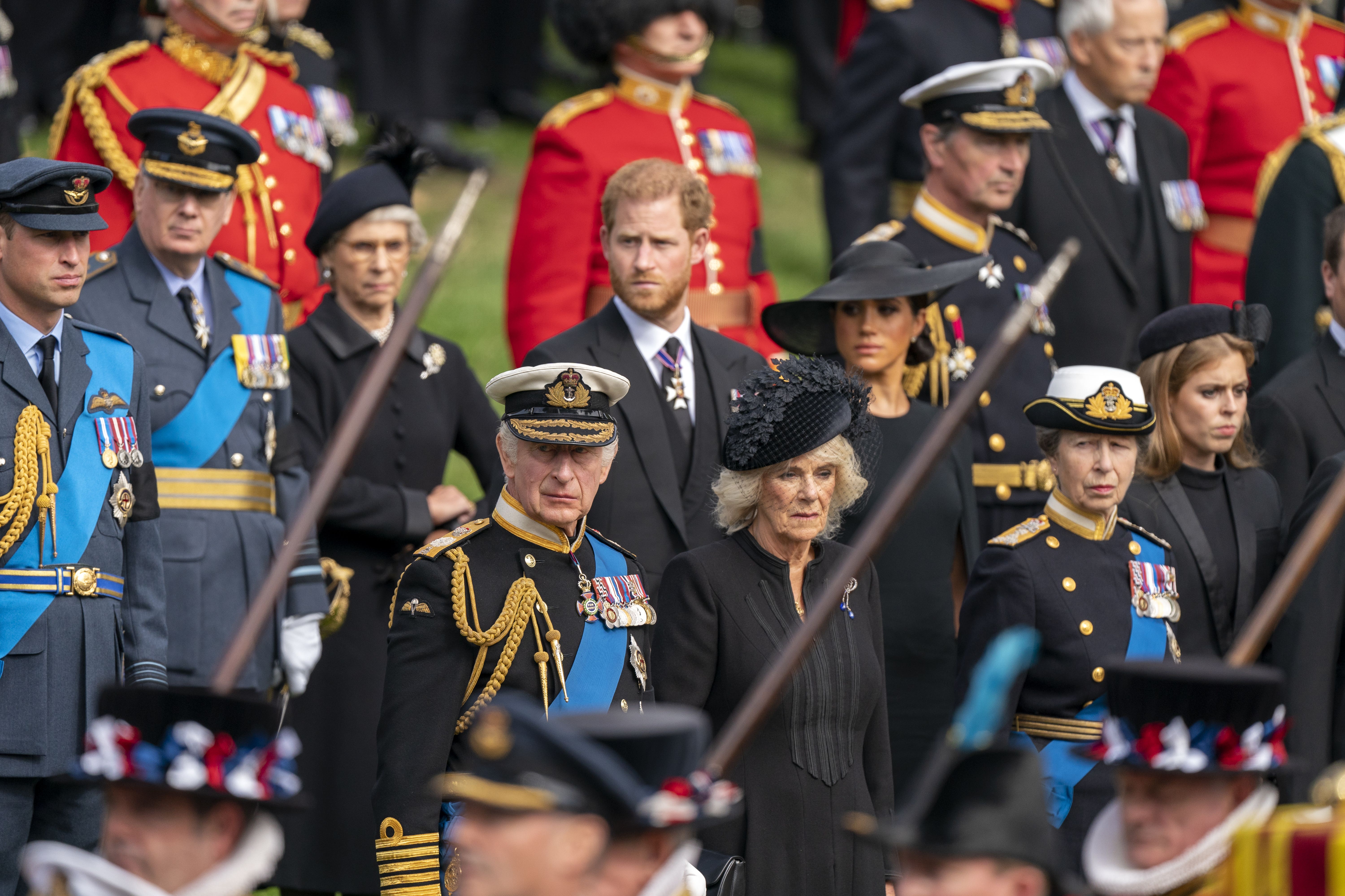 The Prince of Wales, King Charles III, the Duke of Sussex, the Queen Consort, the Duchess of Sussex and the Princess Royal look on as the State Gun Carriage carrying the coffin of Queen Elizabeth II (Jane Barlow/PA)