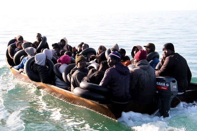<p>Migrants, mainly from sub-Saharan Africa, are stopped by Tunisian Maritime National Guard at sea during an attempt to get to Italy, near the coast of Sfax, Tunisia, Tuesday, April 18, 2023</p>