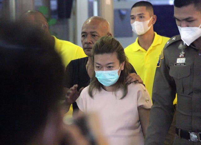 <p>File. Police officers escort Sararat Rangsiwuthaporn</p>