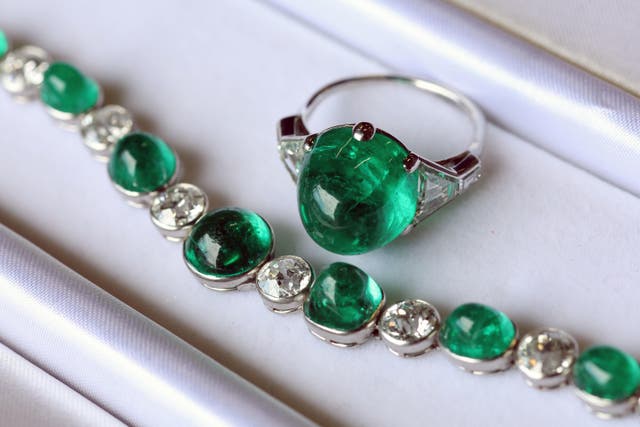 An emerald and diamond bracelet and ring that once belonged to Wallis Simpson, sold for £42,000 at auction (PA)