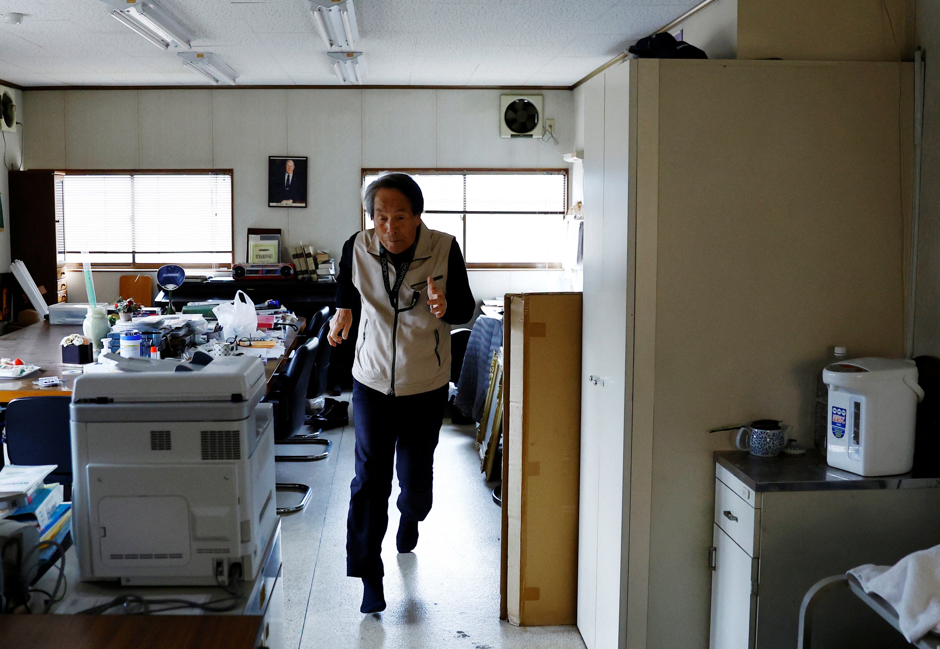 Shingo sprints in his office to keep fit at his office in Tokyo