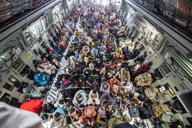 <p>In this handout image provided by the Ministry of Defence, a full flight of 265 people are evacuated out of Kabul by the UK Armed Forces on 21 August 2021 in Kabul, Afghanistan</p>