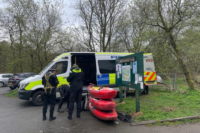 Police divers at the scene at Mugdock Country Park, East Dunbartonshire, as police continue their search for the partner of Marelle Sturrock (Lucinda Cameron/PA)