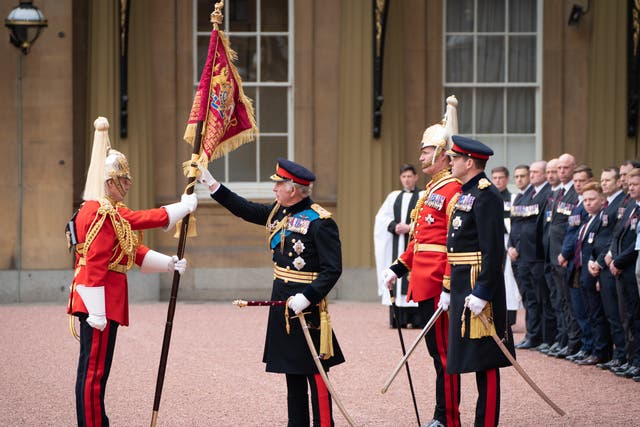 <p>King Charles III presents new Standards and Colours to the Life Guards of the Household Cavalry Mounted Regiment at Buckingham Palace on April 27, 2023</p>