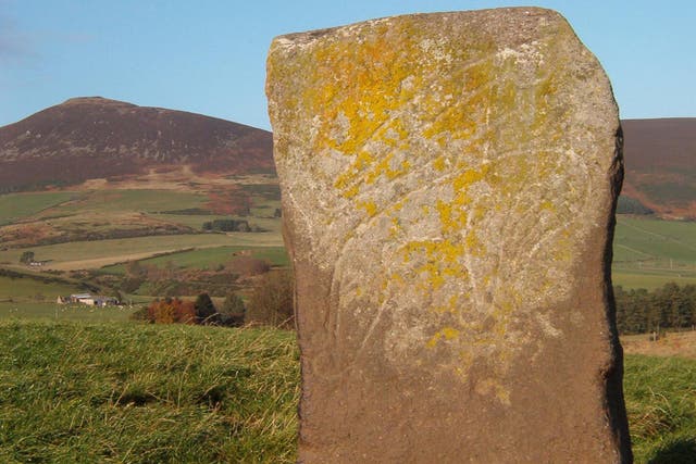 The Craw Stane, with Tap O’ Noth hillfort on the left horizon (University of Aberdeen/PA)