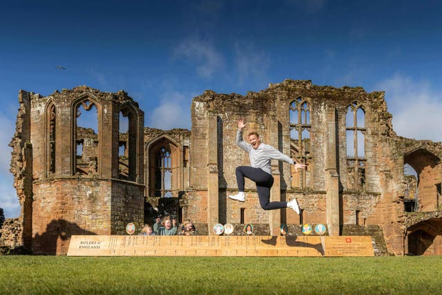 Daphne, Milo and Rex Rutherford watch their gold medal-winning Olympian father Greg Rutherford jump the Ruler of Rulers at Kenilworth Castle near Coventry (Christopher Ison/English Heritage/PA)
