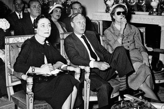 The Duke and Duchess of Windsor watching the coronation of Queen Elizabeth II on the television screen in Paris (PA)