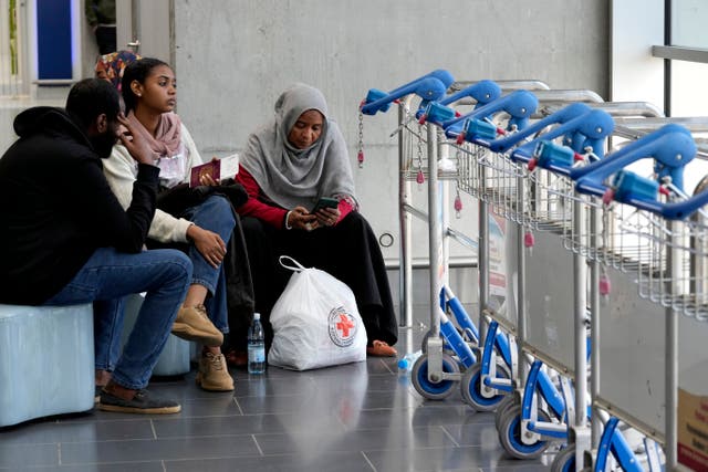 <p>Evacuees from Sudan wait for their flight at Larnaca airport, Cyprus, where the retired doctor has arrived safely with his daughter and his 87-year-old mother </p>