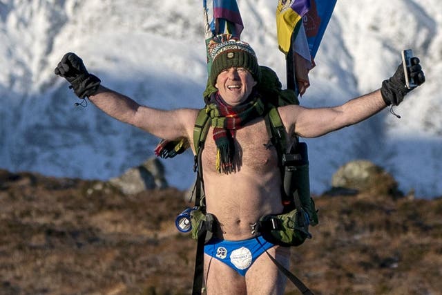 Mick Cullen, otherwise known as Speedo Mick, walks through Glencoe in sub-zero temperatures wearing only his swimming trunks. Mick is walking 1,000 miles from John O’Groats to Land’s End whilst also completing the Three-Peak Challenge to scale Ben Nevis, Scafell Pike and Mount Snowdon along the way (Jane Barlow/PA Wire)