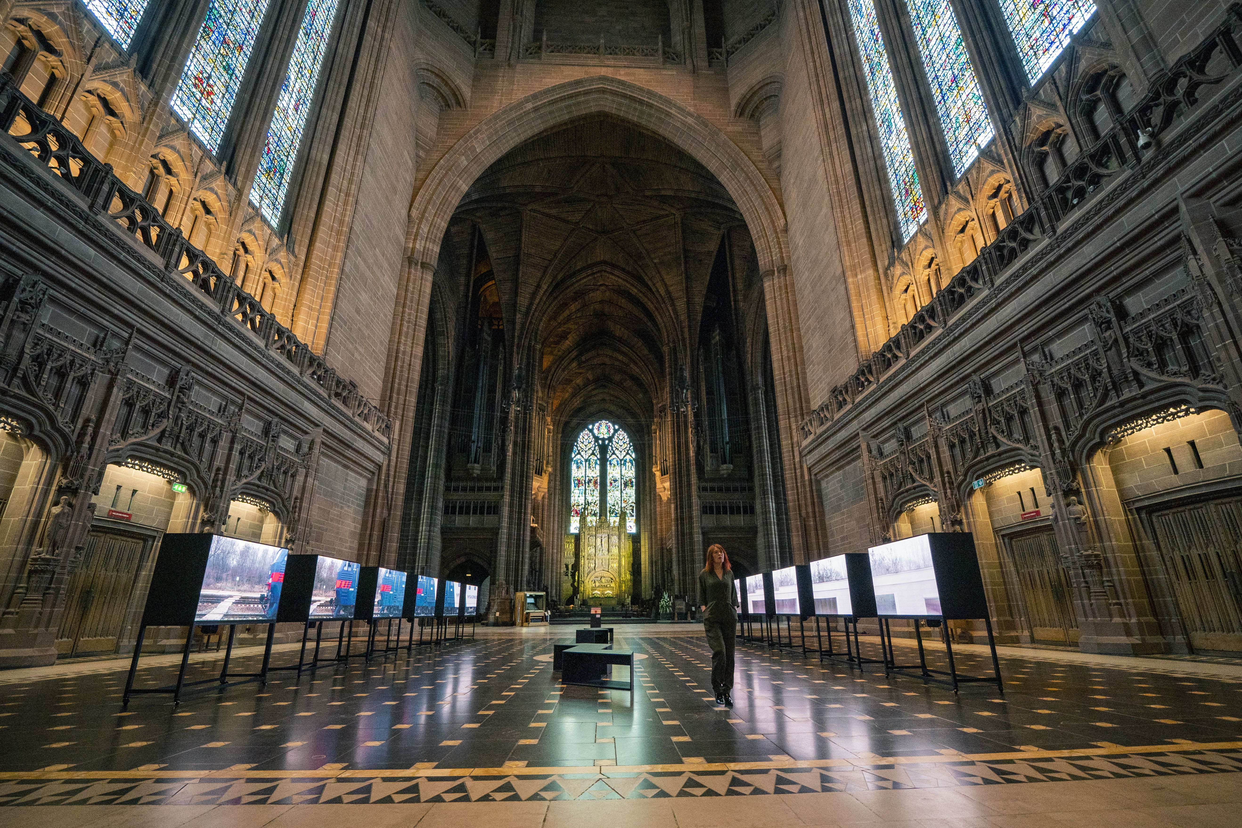 A person watches Izyum to Liverpool inside Liverpool Cathedral (Peter Byrne/PA)