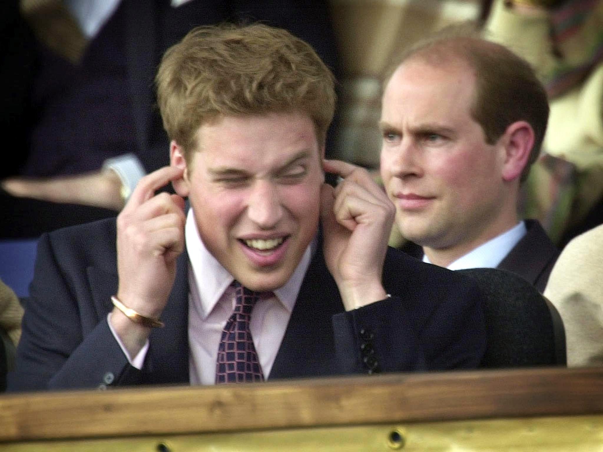 Prince William blocks his ears during Party at the Palace in the summer of 2002
