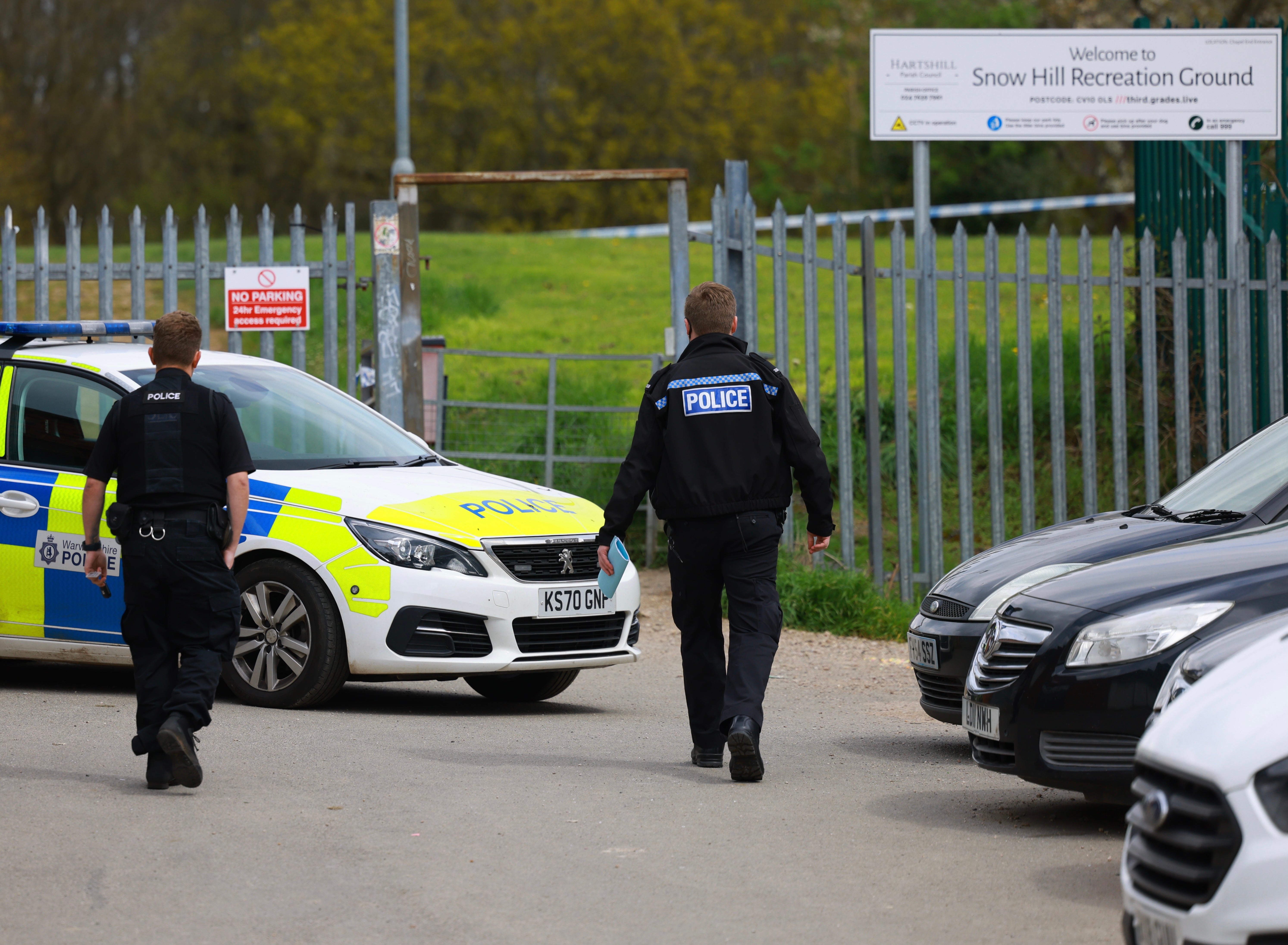 A police car close to the entrance to Snow Hill Recreation Ground, which has been sealed off with police tape.