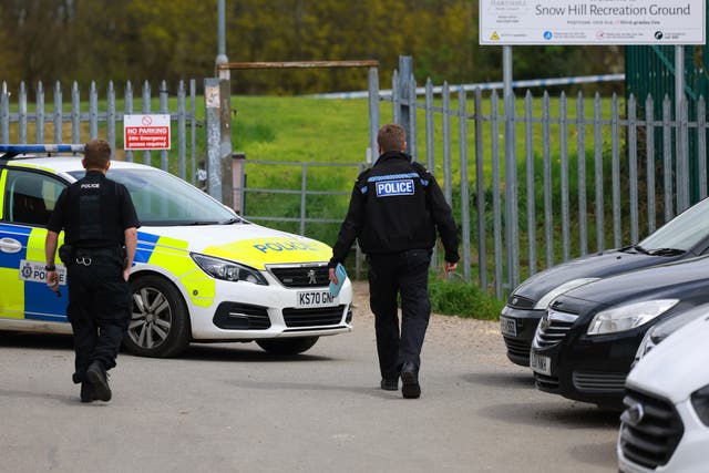 <p>A police car close to the entrance to Snow Hill Recreation Ground, which has been sealed off with police tape. </p>