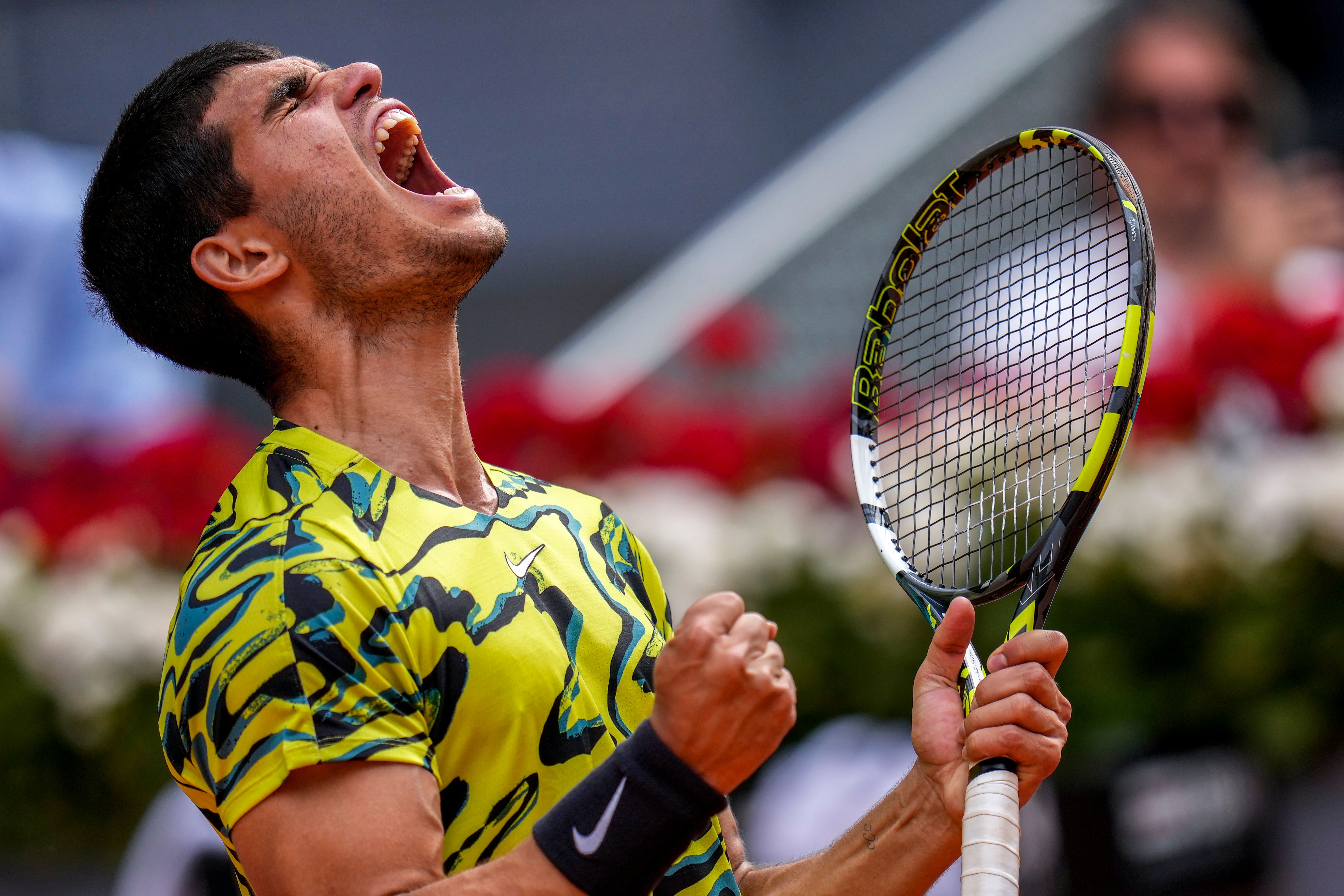 Carlos Alcaraz, pictured, celebrates during his narrow victory over Emil Ruusuvuori (Manu Fernandez/AP)