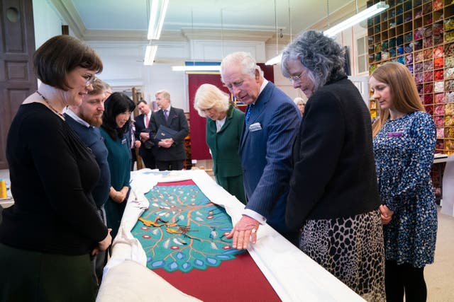 EMBARGOED TO 2200 BST FRIDAY APRIL 28King Charles III and the Queen Consort look at the needlework on part of the Anointing Screen during their visit to the Royal College of Needlework at Hampton Court Palace in East Molesey, Surrey, to view the progress, and to meet the craftspeople and embroiderers who contributed to the project. The Anointing Screen will be used for the most sacred moment of the coronation on May 6, before the investiture and crowning of the King. Picture date: Tuesday March 21, 2023. PA Photo. The screen – which represents the 56 member countries of the Commonwealth – was designed by iconographer Aidan Hart and created using both hand and digital embroidery, managed by the Royal School of Needlework. It has been gifted for the occasion by the City of London Corporation and City Livery Companies. See PA story ROYAL Coronation Screen. Photo credit should read: Kirsty O’Connor/PA Wire