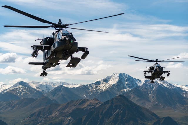 <p>FILE - In this photo released by the U.S. Army, AH-64D Apache Longbow attack helicopters from the 1st Attack Battalion, 25th Aviation Regiment, fly over a mountain range near Fort Wainwright, Alaska, on June 3, 2019. </p>